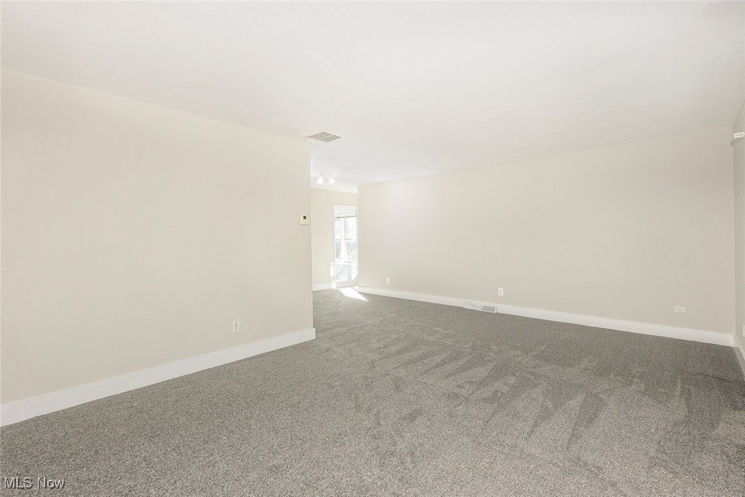 1691 Harwich Road Lyndhurst, OH 44124 - Photo 8 of 45 Carpeted living room room featuring baseboards