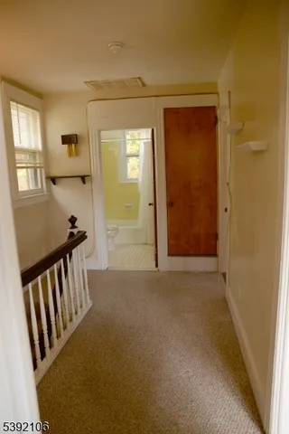 a view of a hallway with windows