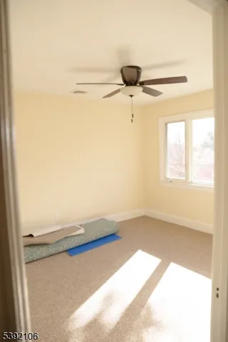 a view of a air conditioner and an empty room