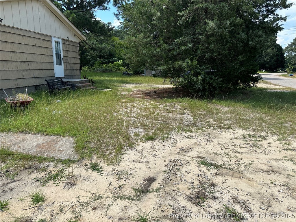 5758 Camden Road Fayetteville, NC 28306 - Photo 3 of 5 a view of a backyard of the house