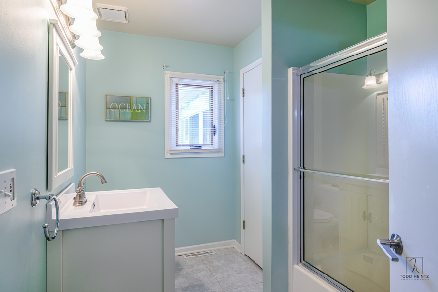 11506 Cemetery Road Capron, IL 61012 - Photo 12 of 42 a bathroom with a sink and mirror