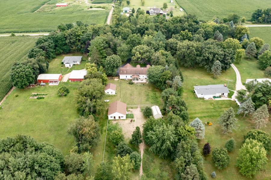 11506 Cemetery Road Capron, IL 61012 - Photo 26 of 42 an aerial view of lake residential house with outdoor space and trees around
