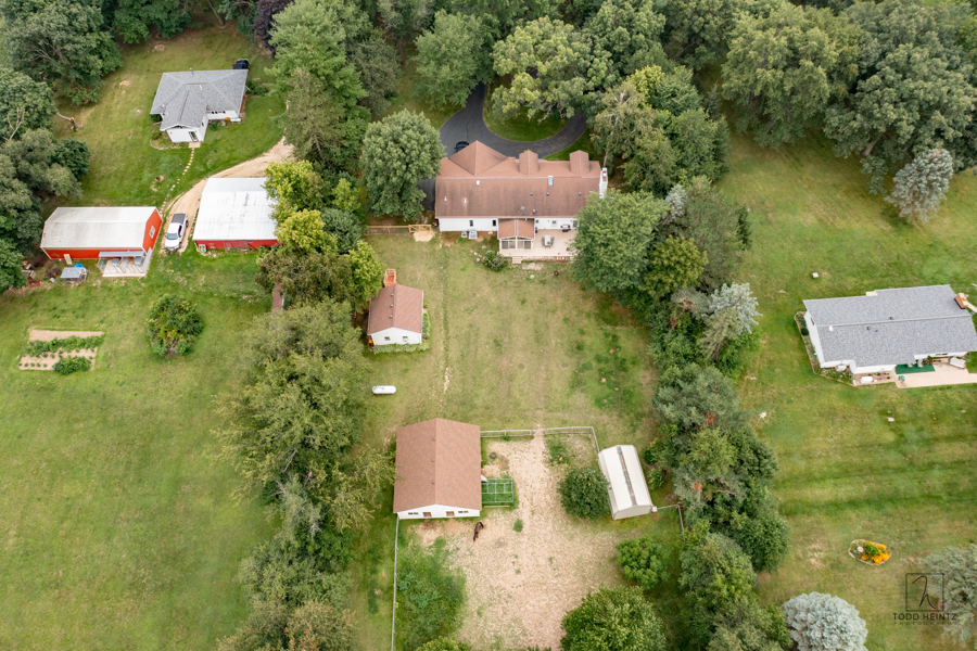 11506 Cemetery Road Capron, IL 61012 - Photo 30 of 42 an aerial view of residential house with outdoor space and trees all around