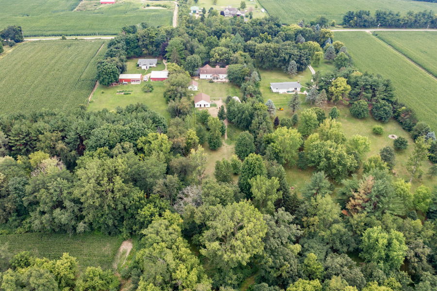 11506 Cemetery Road Capron, IL 61012 - Photo 32 of 42 an aerial view of residential houses with outdoor space and trees