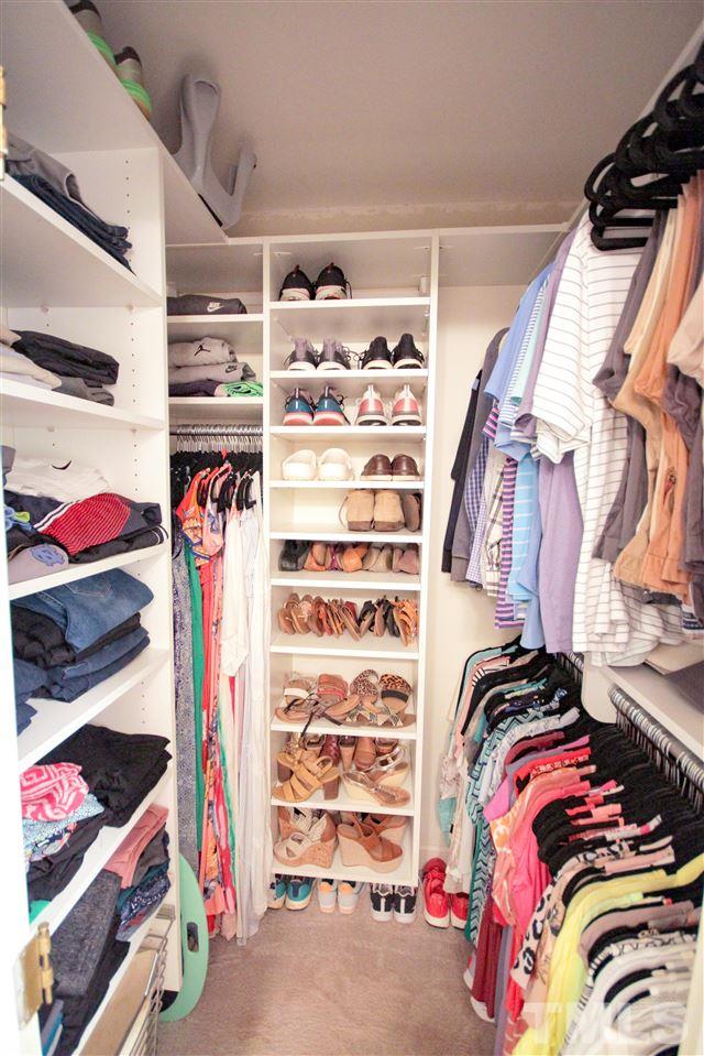 8212 Hambledon Court Raleigh, NC 27615 - Photo 17 of 28 a view of walk in closet with clothes and shoes