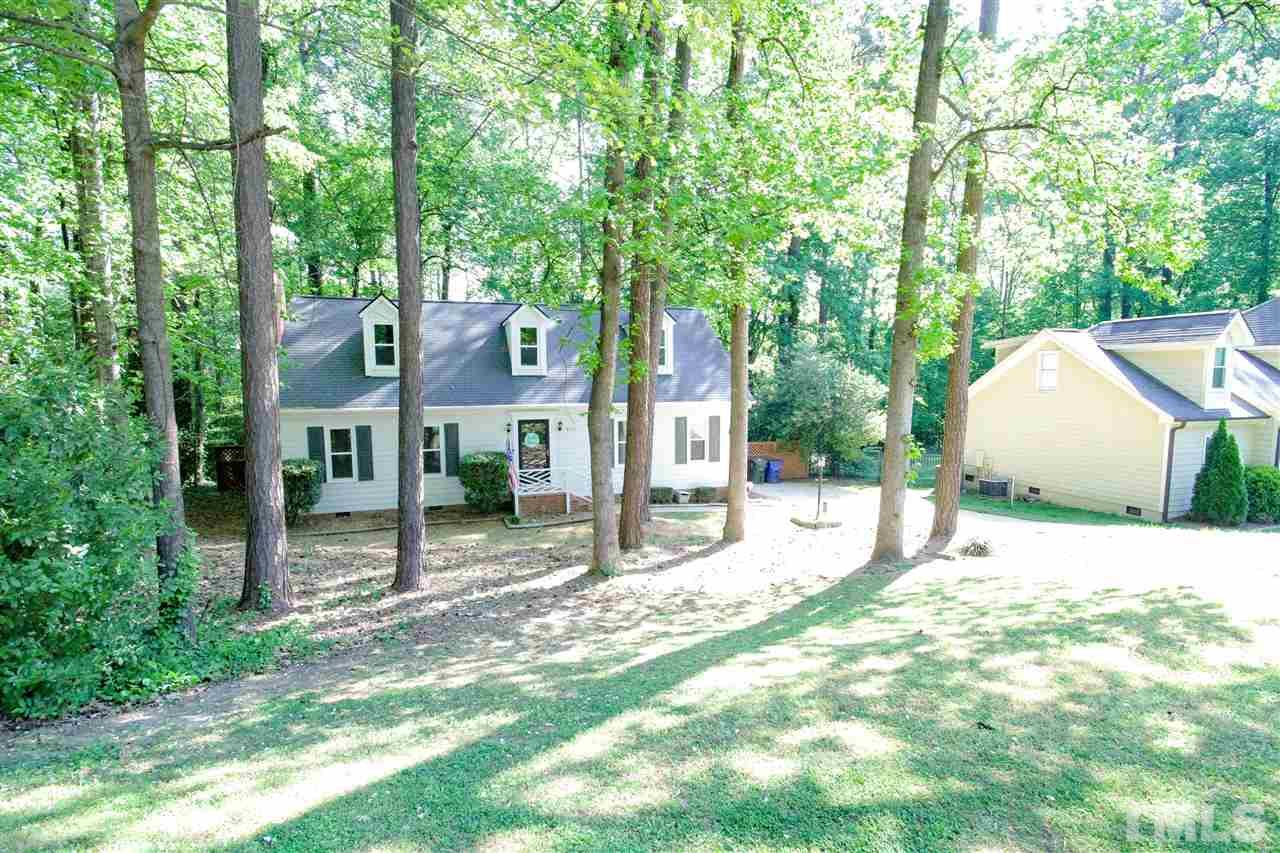 8212 Hambledon Court Raleigh, NC 27615 - Photo 24 of 28 a view of a house with a yard and large tree