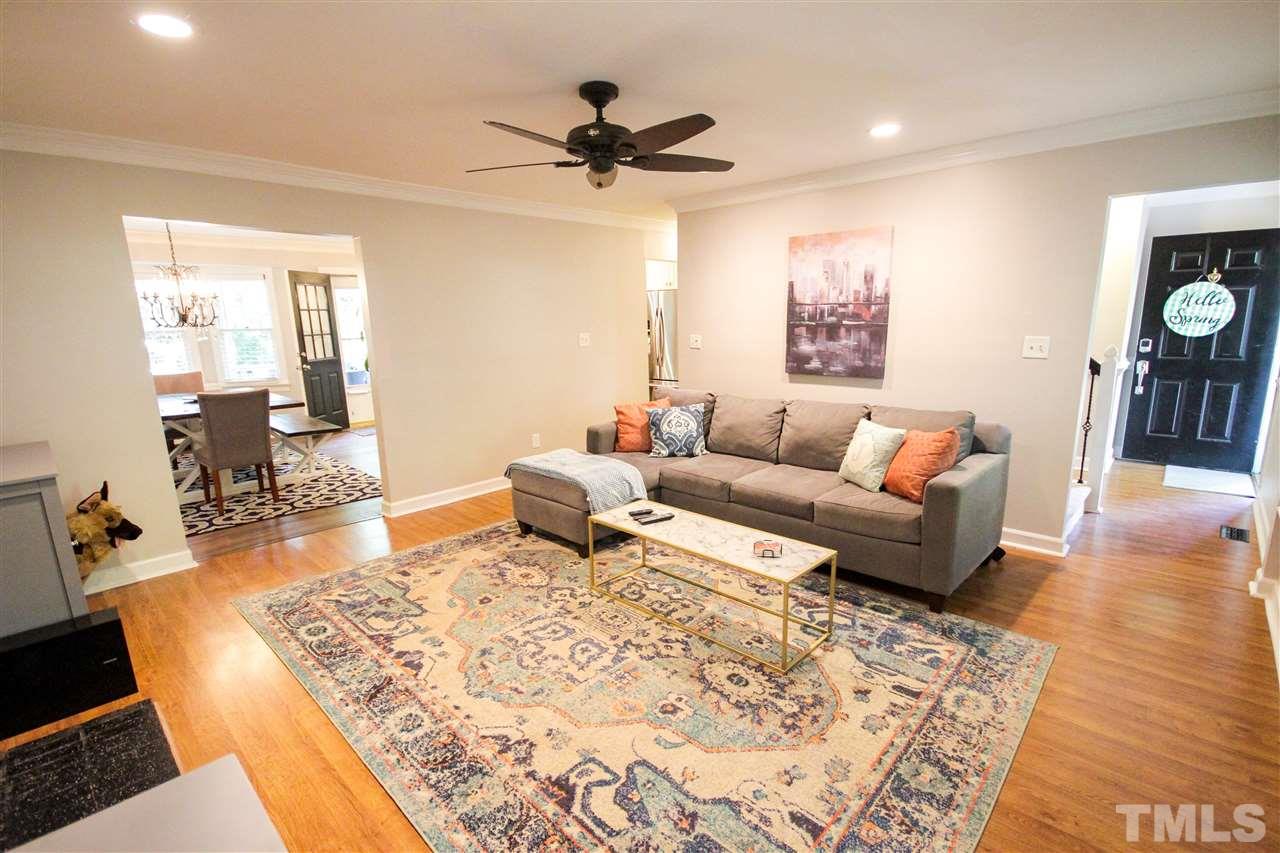 8212 Hambledon Court Raleigh, NC 27615 - Photo 7 of 28 a living room with furniture and a rug