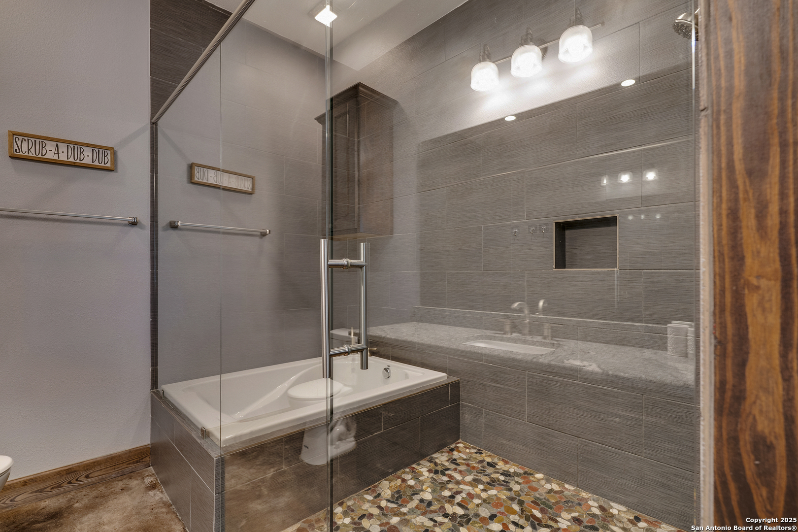 1185 Mountain Vly Drive Concan, TX 78838 - Photo 14 of 27 a bathroom with a sink and a mirror