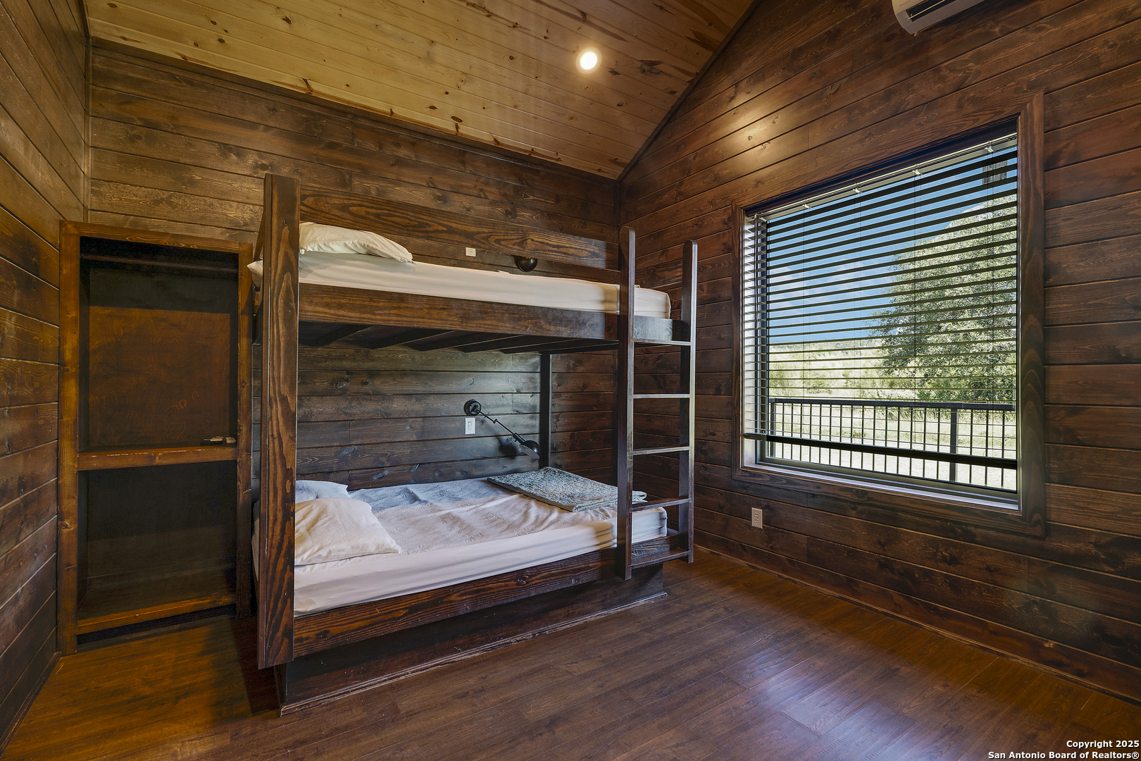 1185 Mountain Vly Drive Concan, TX 78838 - Photo 18 of 27 a bedroom with a bed and a window