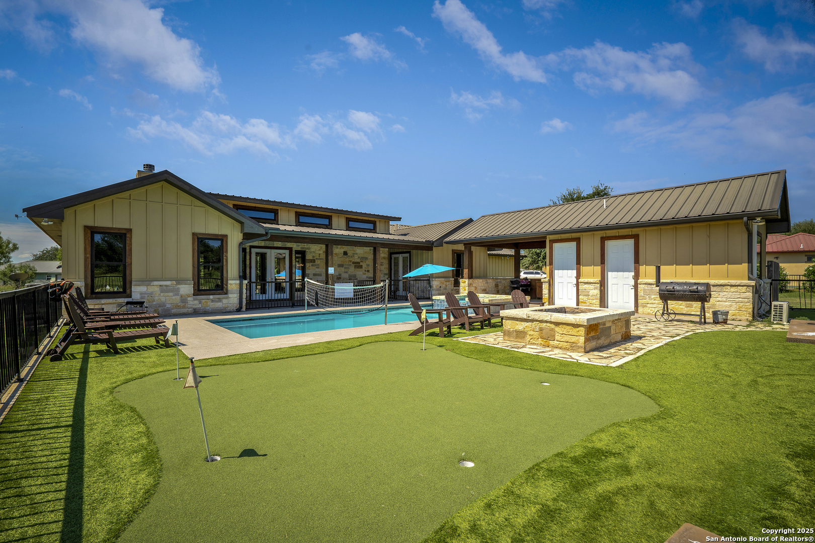 1185 Mountain Vly Drive Concan, TX 78838 - Photo 21 of 27 a view of a house with swimming pool and sitting area