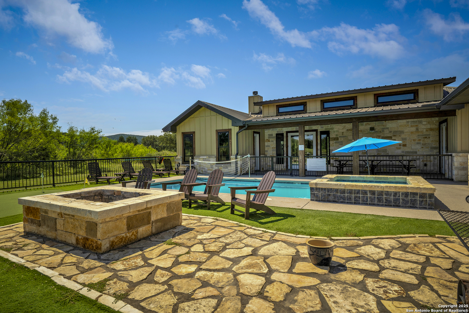 1185 Mountain Vly Drive Concan, TX 78838 - Photo 23 of 27 a front view of a house with garden