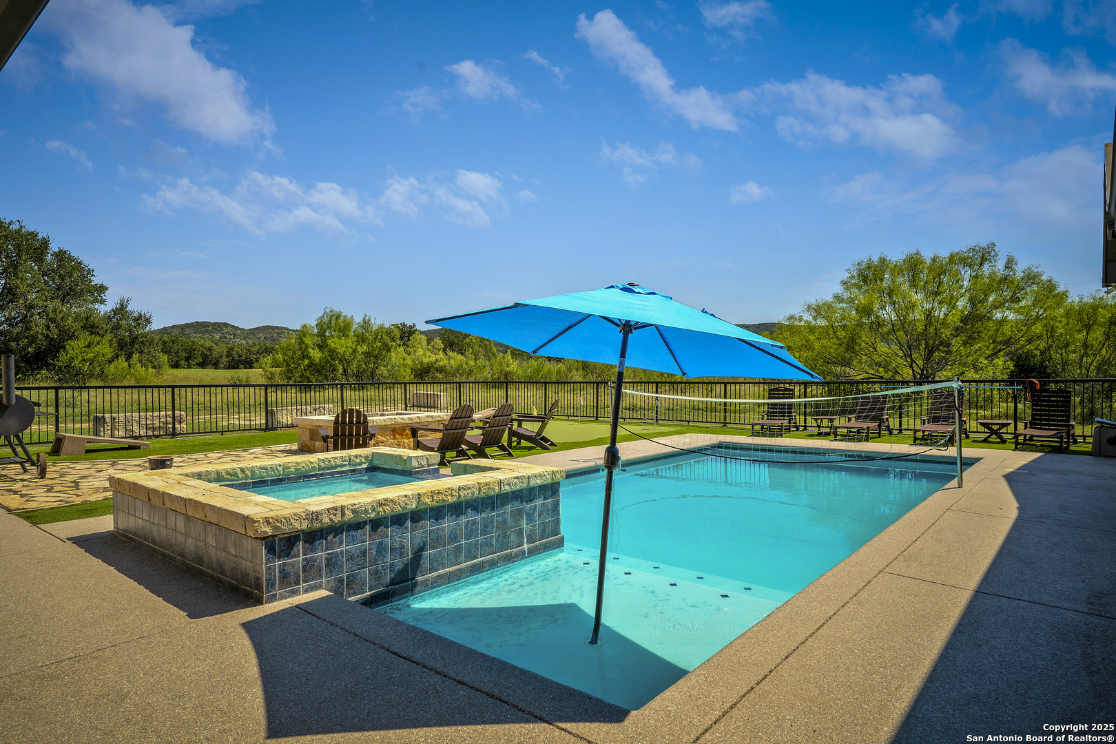 1185 Mountain Vly Drive Concan, TX 78838 - Photo 25 of 27 a view of a house with swimming pool and yard