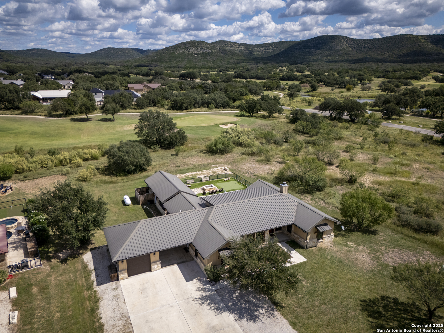 1185 Mountain Vly Drive Concan, TX 78838 - Photo 3 of 27 aerial view of a house with a yard and lake view