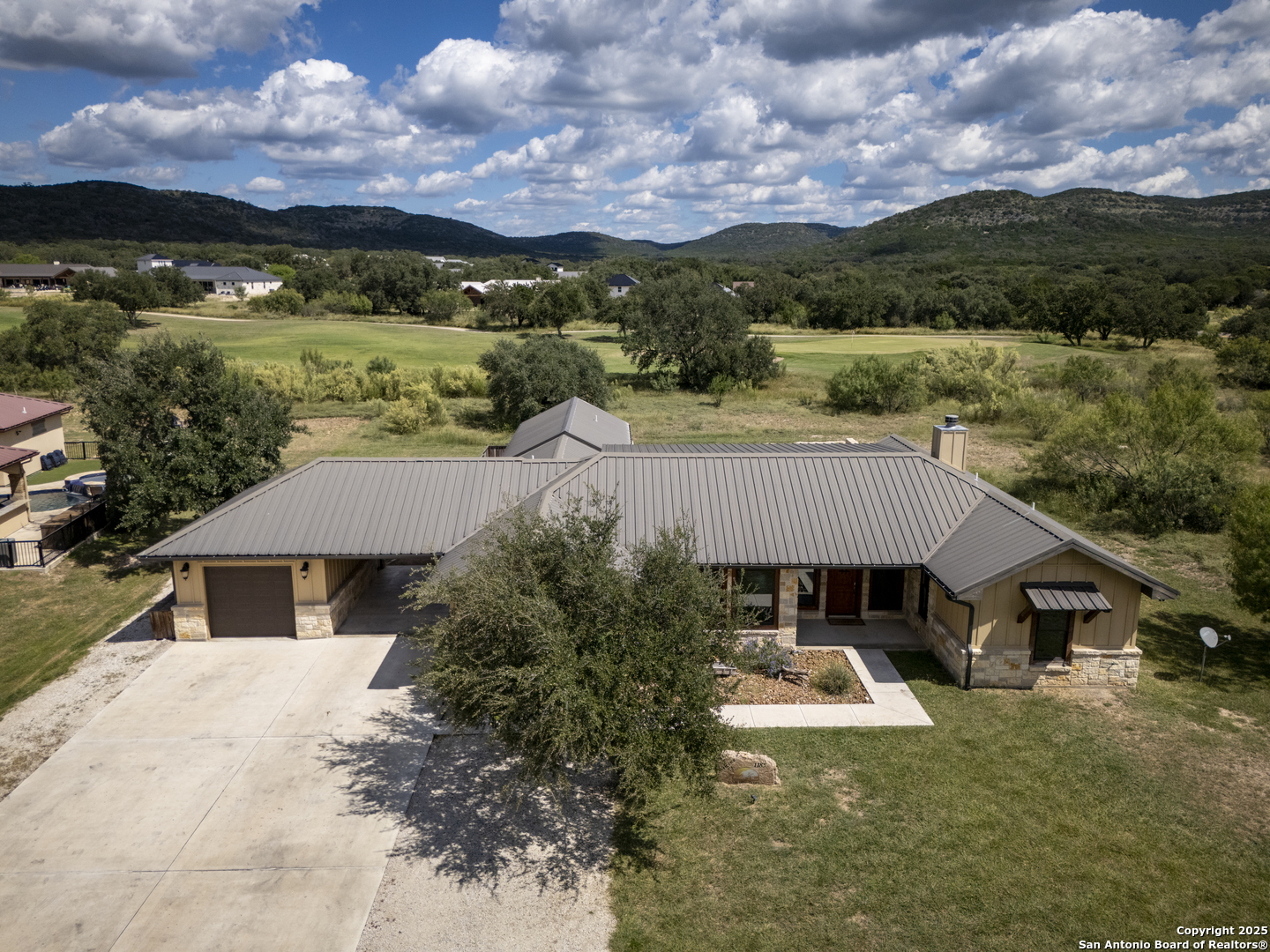 1185 Mountain Vly Drive Concan, TX 78838 - Photo 4 of 27 an aerial view of house with yard and mountain view in back