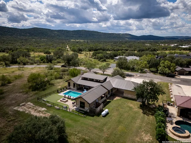 an aerial view of a house with a garden