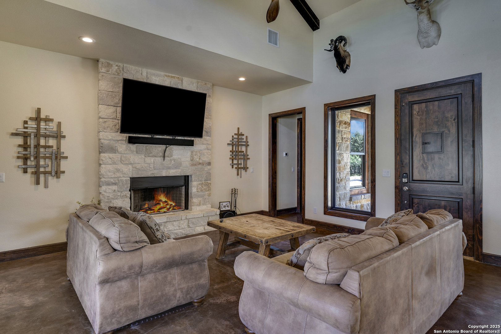 1185 Mountain Vly Drive Concan, TX 78838 - Photo 9 of 27 a living room with furniture fireplace and flat screen tv