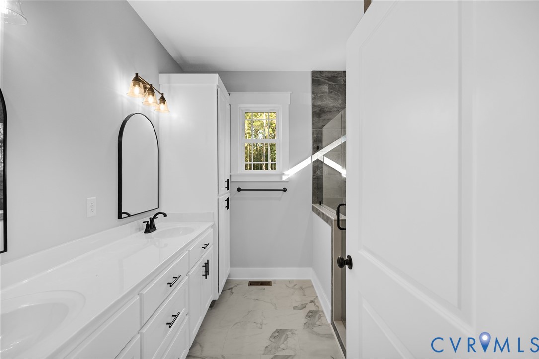 19106 Carson Road Dinwiddie, VA 23841 - Photo 12 of 34 Double vanity with white countertops, integrated s