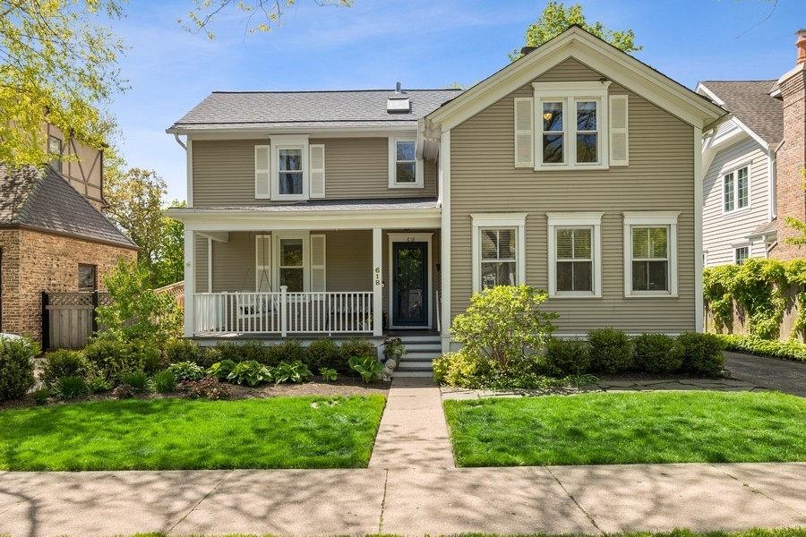 618 Willow Road Winnetka, IL 60093 - Photo 1 of 27 a front view of a house with a yard