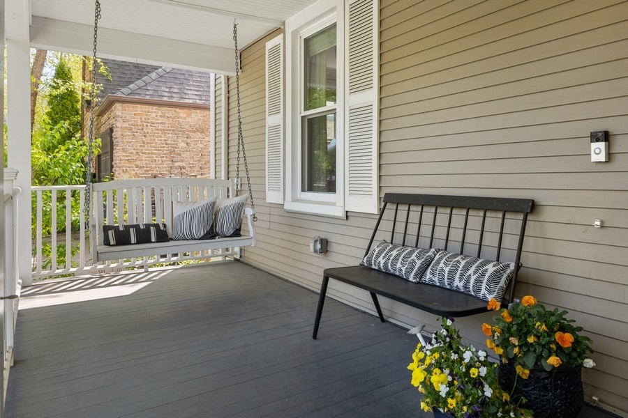 618 Willow Road Winnetka, IL 60093 - Photo 2 of 27 a view of a porch with furniture and a potted plant
