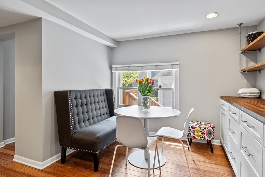 618 Willow Road Winnetka, IL 60093 - Photo 13 of 27 a view of a dining room with furniture and wooden floor