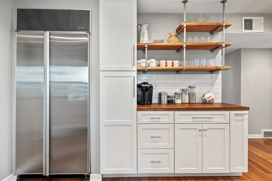 618 Willow Road Winnetka, IL 60093 - Photo 14 of 27 a kitchen with cabinets and a window