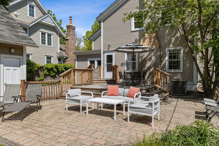 618 Willow Road Winnetka, IL 60093 - Photo 4 of 27 a view of a patio with a table and chairs in patio
