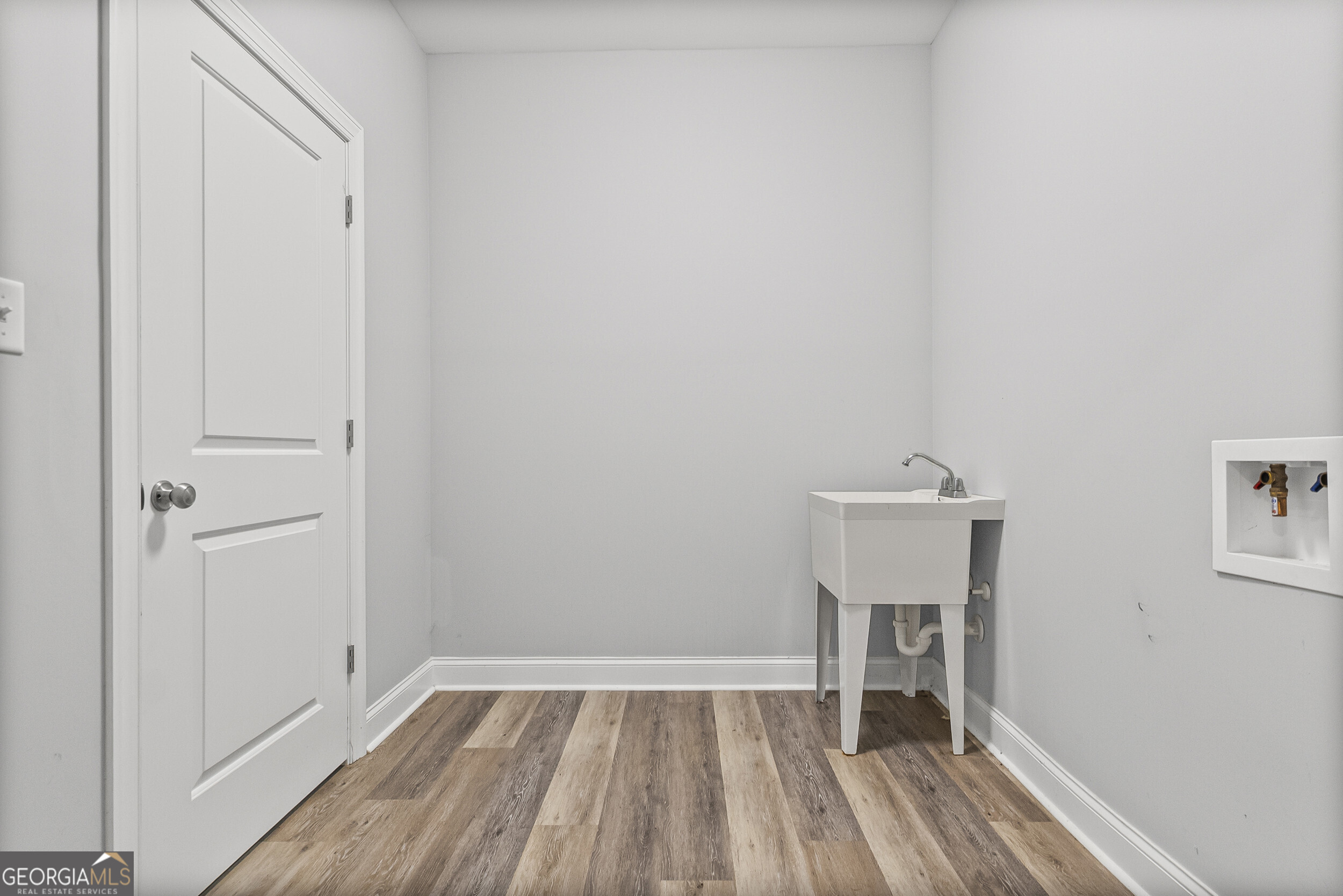 144 Scarlet Way Leesburg, GA 31763 - Photo 25 of 30 a view of a room with wooden floor and a sink