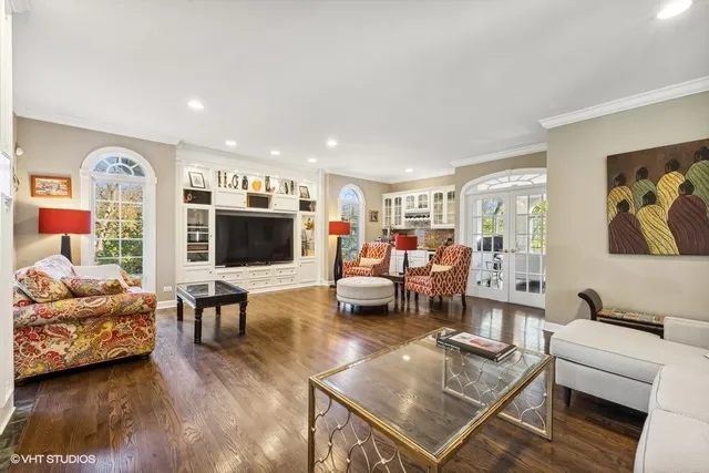a living room with furniture and a large windows
