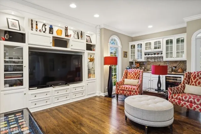 a living room filled with furniture and a potted plant