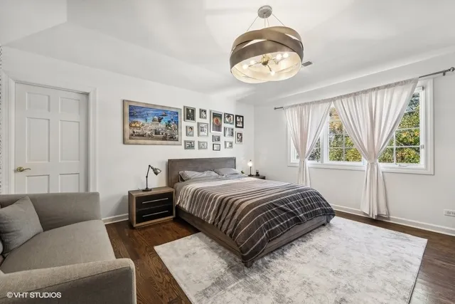 a bathroom with a toilet a sink and a mirror