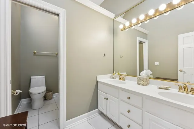 a bathroom with a toilet and shower curtain
