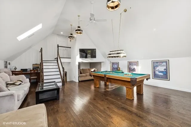 a view of a couches and a fire pit in the patio in front of a house