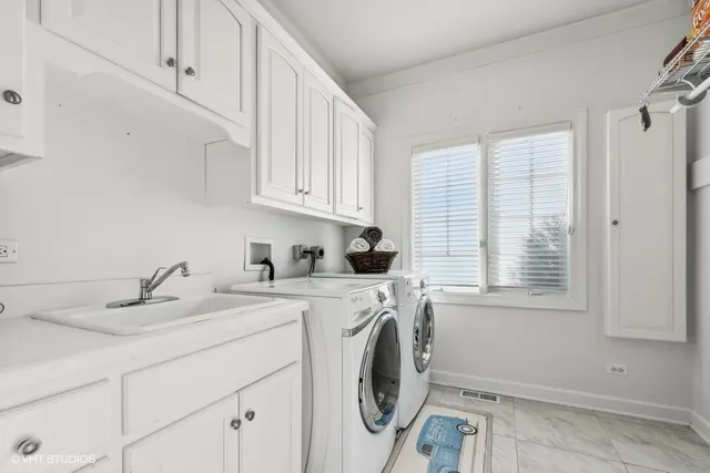 a view of a yard with wooden fence