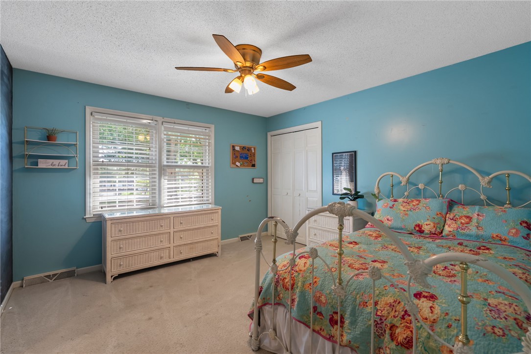 3513 Hopewell Road Anderson, SC 29621 - Photo 5 of 50 A comforting bedroom features a ceiling fan, carpet, and dual windows.