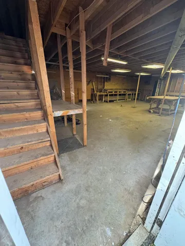 a view of an empty room with stairs