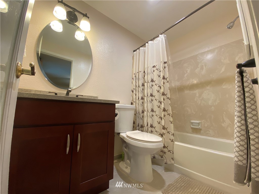 23431 11th Avenue West Bothell, WA 98021 - Photo 14 of 30 a bathroom with a sink toilet and shower