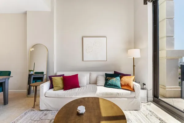 a living room with furniture and a flat screen tv