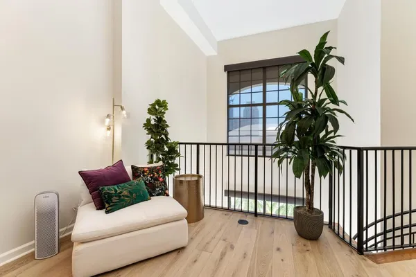 a bedroom with furniture and a potted plant