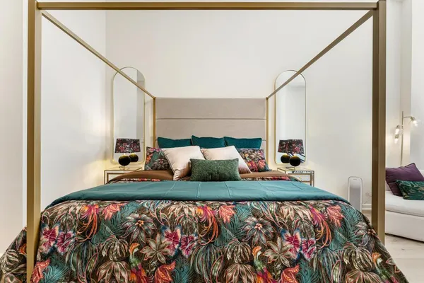 a bathroom with a tub sink and mirror