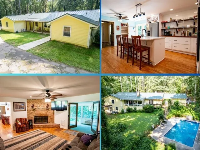 a view of a backyard with table and chairs under an umbrella
