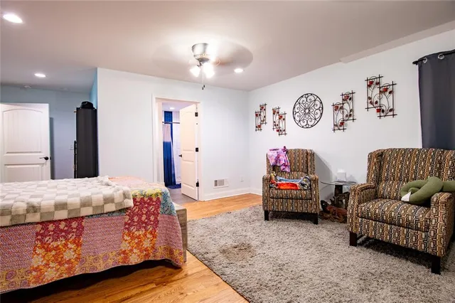 a spacious bathroom with a sink toilet and a mirror