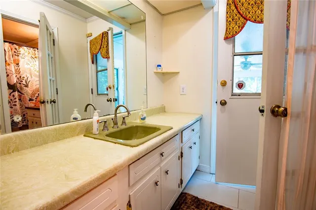 a kitchen with refrigerator cabinets and wooden floor