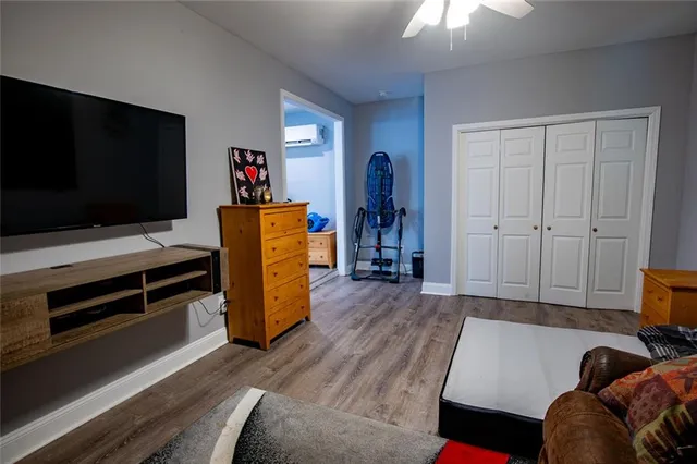 a bathroom with a granite countertop toilet and a bathtub
