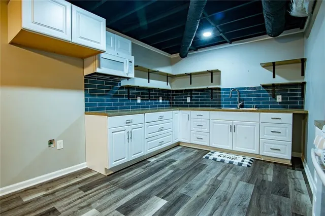 a big yard with lots of green space and trees