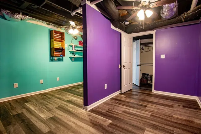 a view of a house with a yard and floor to ceiling window