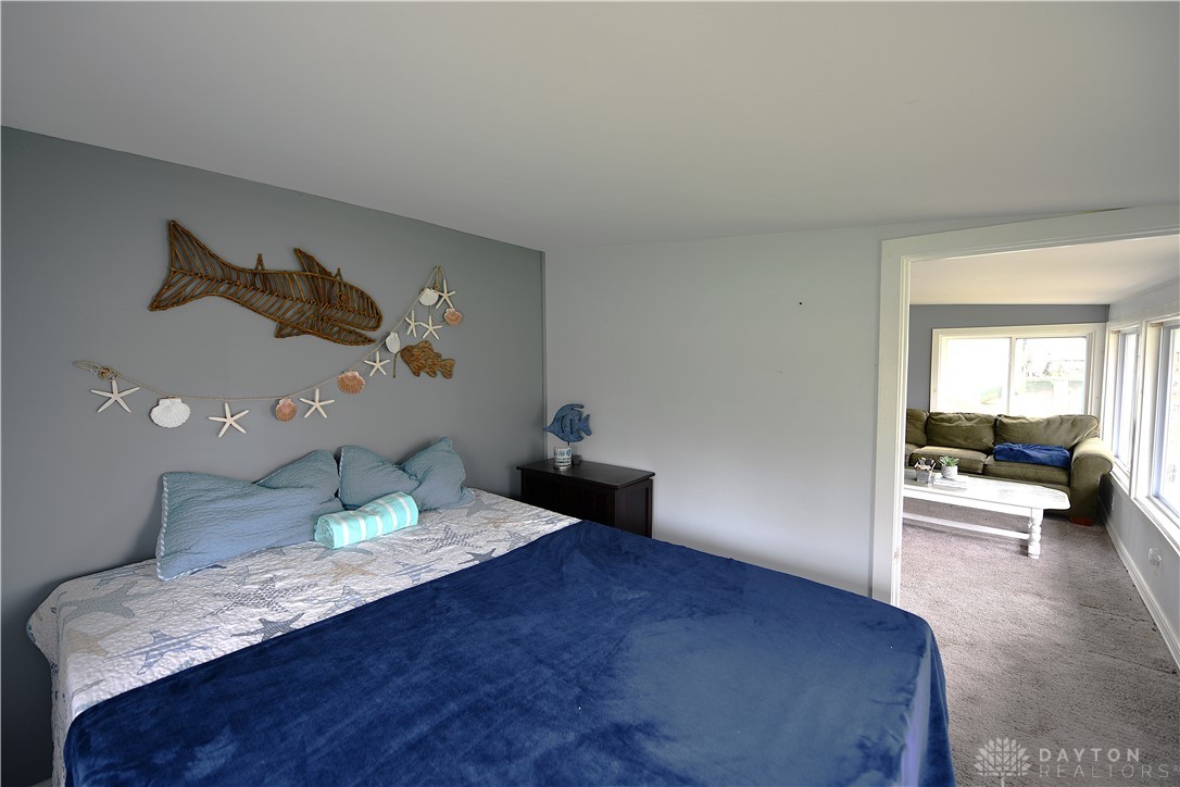 5445 Behm Road, Unit 15 Celina, OH 45822 - Photo 20 of 49 This cozy bedroom provides a tranquil retreat, offering comfortable living with an adjacent relaxation space.