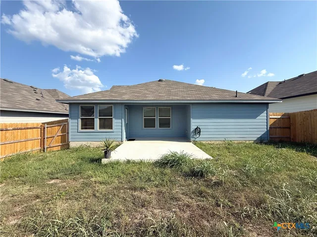 a house view with a garden space