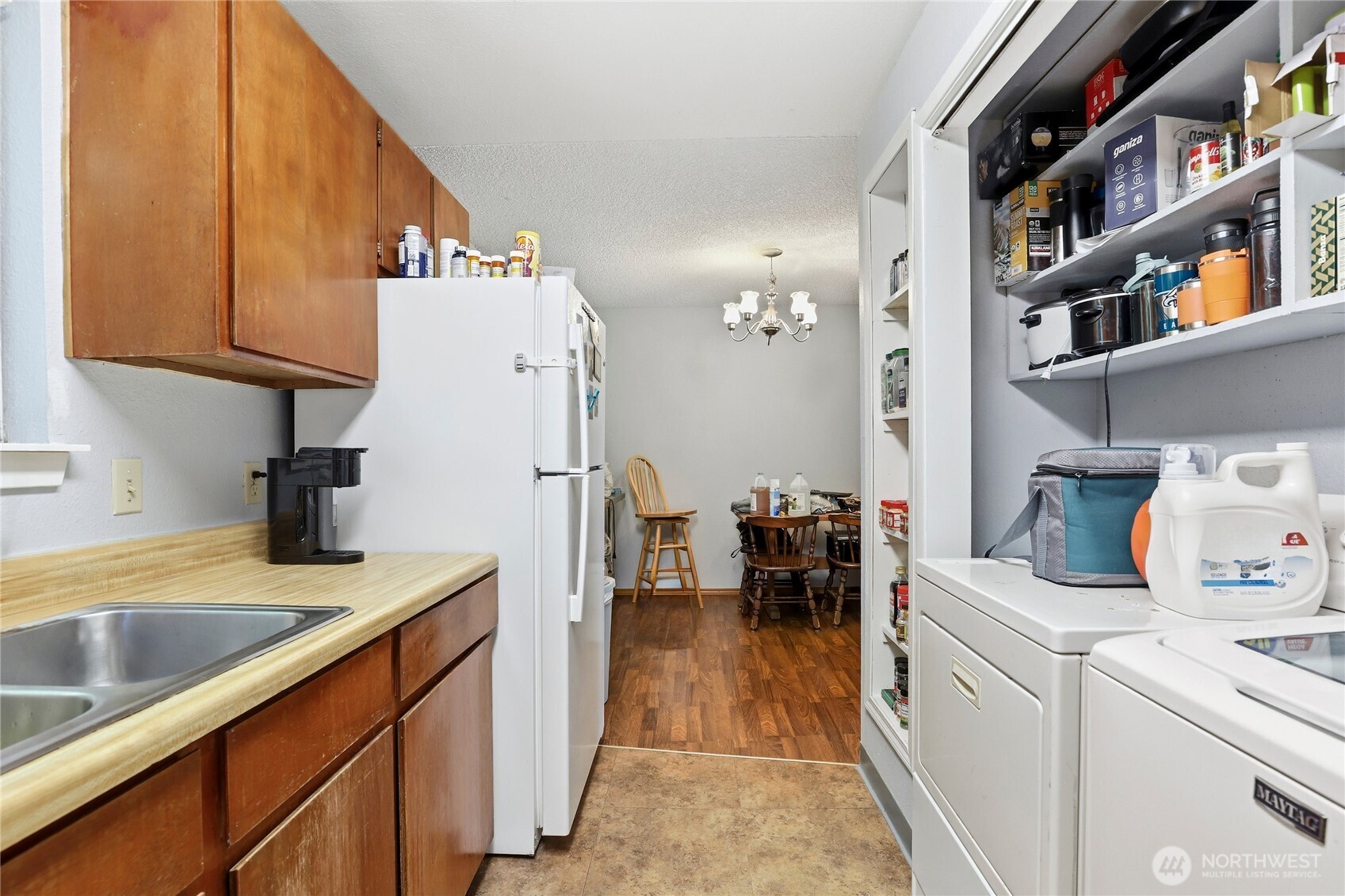 2533 Fir Avenue Bremerton, WA 98310 - Photo 25 of 38 a kitchen with refrigerator and cabinets