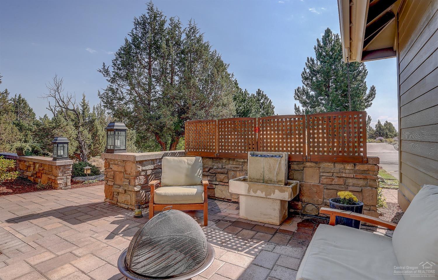 8915 Merlin Drive Redmond, OR 97756 - Photo 22 of 25 Front patio with water feature