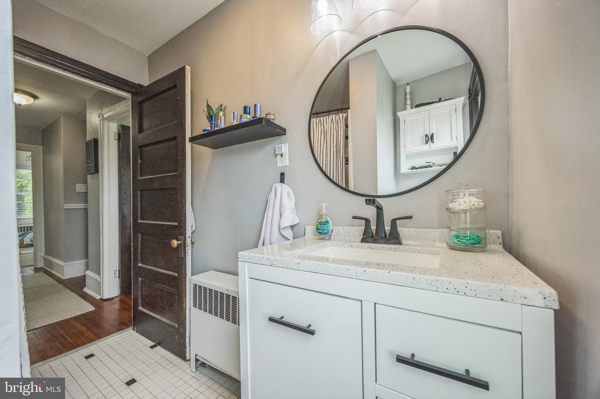 665 U Street King of Prussia, PA 19406 - Photo 18 of 26 a bathroom with a sink a mirror and a shower